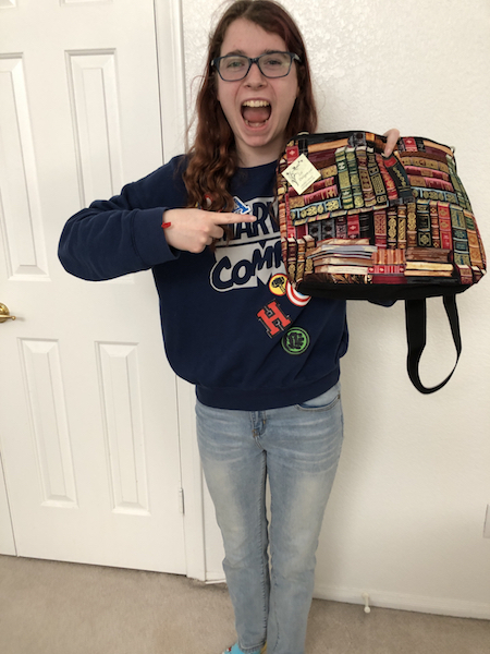 Zoe's Bag Boutique happy customer with book purse